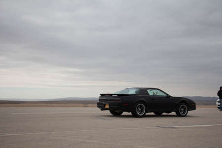 Cars on the race track and on the roads of the desert