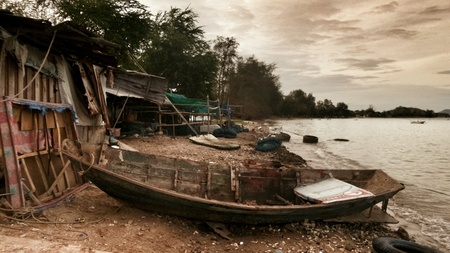 Old fishing boat on the beachの素材