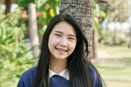 happy young girl against nature background