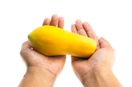 papaya in hand isolate on white backgroundの写真素材
