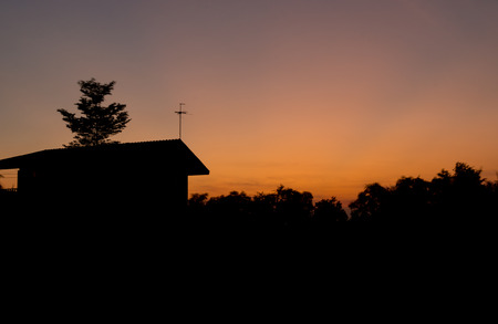 Sunset silhouettes of houses with free space aboveの写真素材