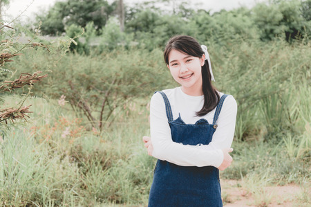 Beautiful young girl in nature background, Pastel Colorの写真素材