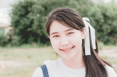 Beautiful young girl in nature background, Pastel Colorの写真素材