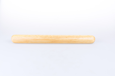 Wooden rolling pin on white backgroundの写真素材
