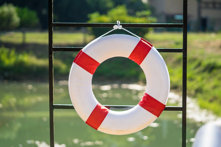 Tied lifebuoy located on the waterfrontの写真素材