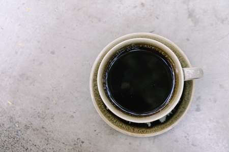 coffee in the green cup on the table , top viewの写真素材