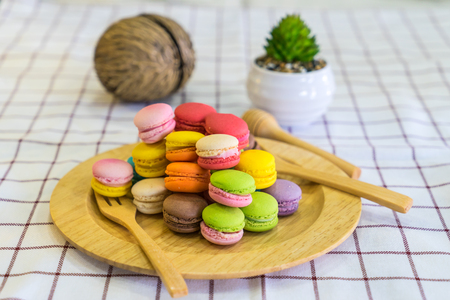 stack of macaron dessert  on woodent plateの写真素材