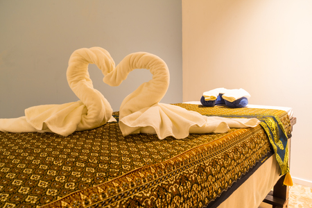 Interior of modern massage and spa room in warm lightの写真素材