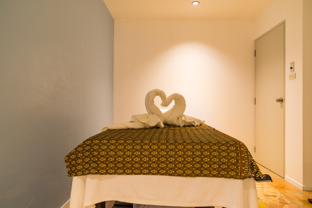 Interior of modern massage and spa room in warm lightのeditorial素材