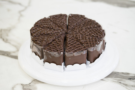 Piece of delicious chocolate cake on plateの写真素材