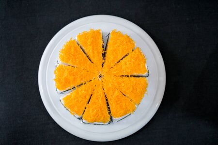Gold Egg Yolk Thread Cakes on wooden plateの写真素材