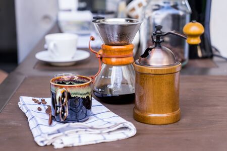 Coffee drip equipment set on wooden table.の写真素材