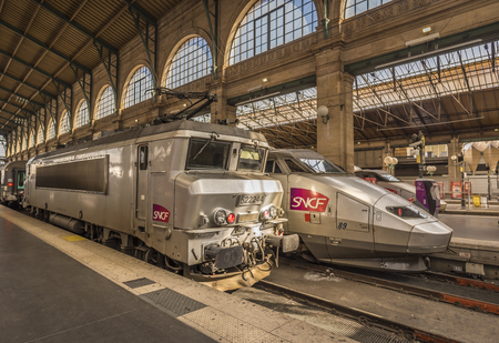 Paris, France - February 15, 2016:  Two different type of SNCF locomotives parked in Gare du Nord,...
