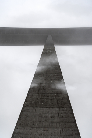Detailed image of a pillar from the highest bridge in Germany, viewed from beneath, piercing the fog...