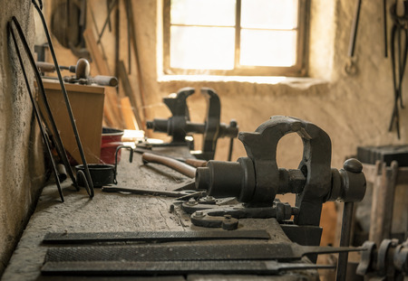 Craftsman workbench with a vise grip and other working tools