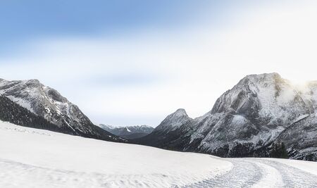 Sunny winter scenery with snow-capped Alps mountain peaks, snow-covered nature, and snowy alpine road, near Ehrwald, Austria, in December.の写真素材