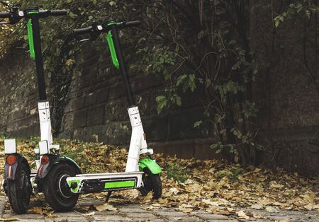 E-scooters on the sidewalk in Stuttgart, Germany. Parked electric scooters on a cold day of autumn....