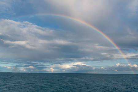 Seascape at Baltic sea with rainbow and cloudy sky. Summer scenery after rain from Rugen island, in Sassnitz, Germany.の写真素材