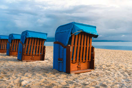 Morning beach scenery with fine sand and beach chairs, on Ruegen Island, at Baltic Sea, Germany. Binz beach resort. European travel destination.の写真素材