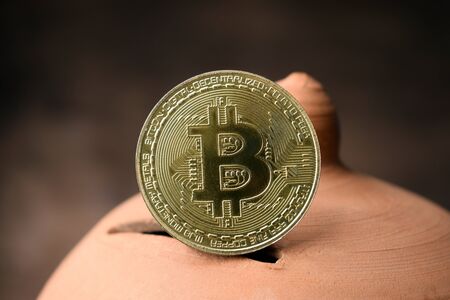 Bitcoin symbol on piggy bankの写真素材