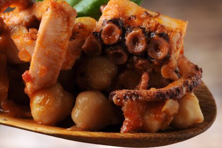 Octopus salad with chickpeas on the spoonの写真素材