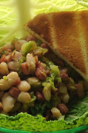 Savoy cabbage salad with beans and baconの写真素材