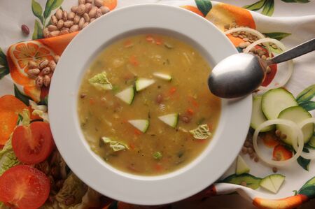 Hot soup with vegetables on the plateの写真素材