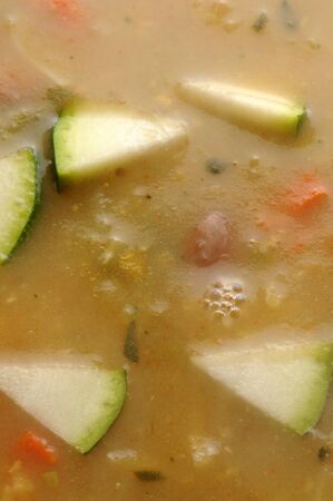 Hot soup with vegetables on the plateの写真素材