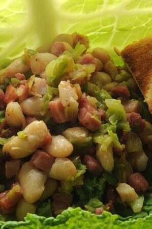 Savoy cabbage salad with beans and baconの写真素材