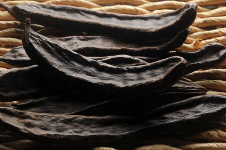 Close up of the dried carobsの写真素材