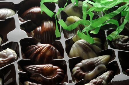 Box of chocolates with carnival confettiの写真素材