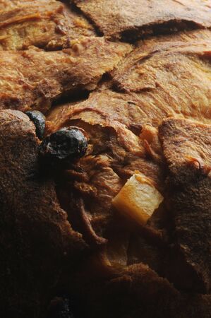 Closeup of panettone crust with raisins and candied fruitの写真素材