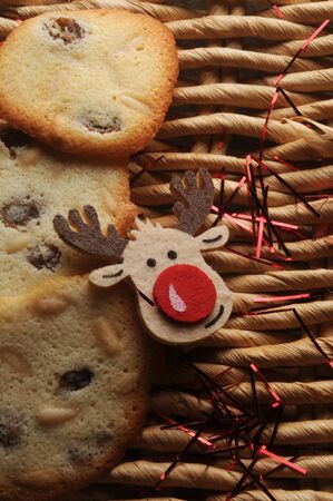 Christmas biscuits with reindeer on straw backgroundの写真素材