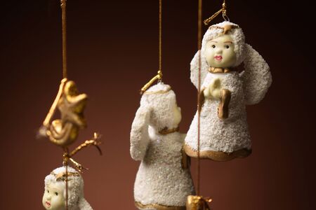 Hanging ceramic cherubs hanging from Christmasの写真素材