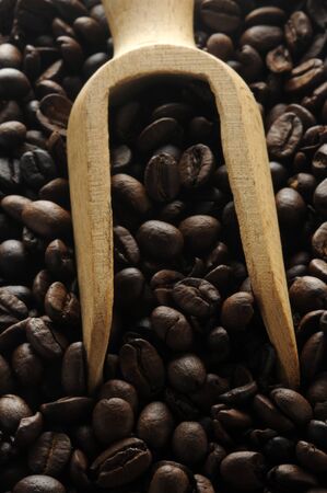 Close up on hand bailer with coffee beansの写真素材