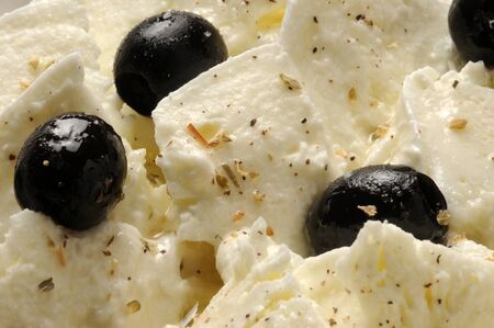 Mozzarella salad with olives and oregano