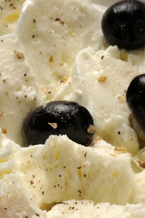 Mozzarella salad with olives and oregano