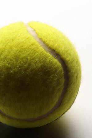 Close up on a yellow tennis ballの写真素材