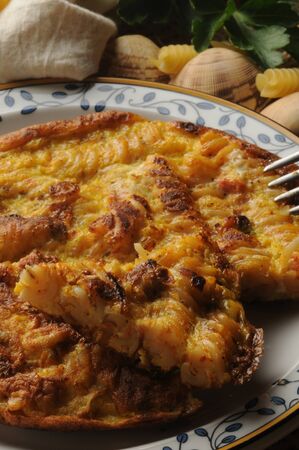 Close up on recycled tomato pasta omelette with clamsの写真素材