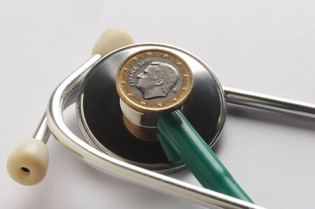 One spanish euro coin on stethoscopeの写真素材