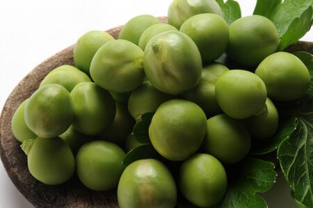 Fresh peas in the spoonの写真素材