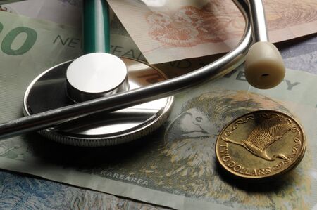Stethoscope on New Zealand banknotesの写真素材