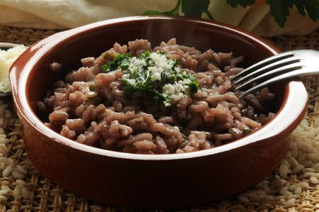 Close up of a plate of red wine risottoの写真素材