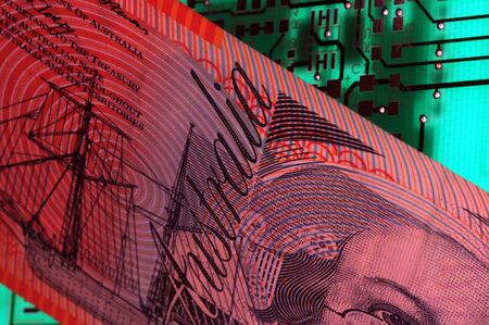 Closeup on australian banknote with circuit boardの写真素材