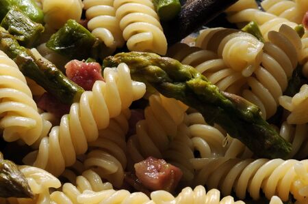 Fusilli with pancetta and asparagusの写真素材
