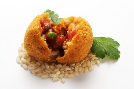 Open arancino, showing the rice and ragù stuffing