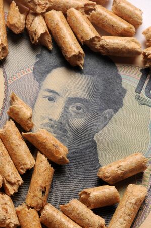Close up on japanese currency with wood pelletsの写真素材