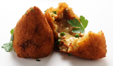 Open arancino, showing the rice and ragù stuffingの写真素材