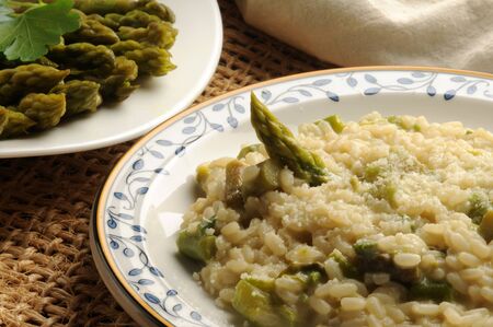 Risotto with green asparagus and parsleyの写真素材