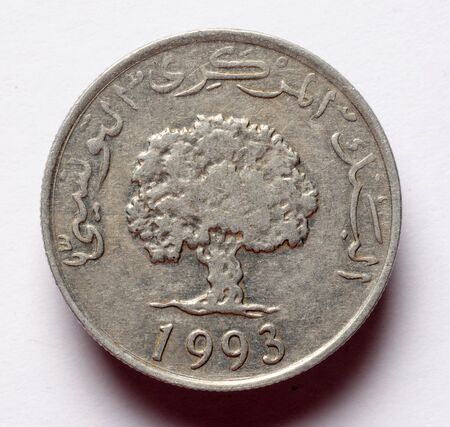 Tunisian coin in aluminum on a white backgroundの写真素材